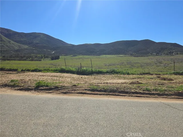 a view of a town with mountains in the background