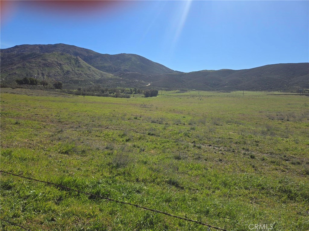 0 Longhorn Road Banning, CA 92220 - Photo 4 of 6 a view of a lush green hillside and a houses