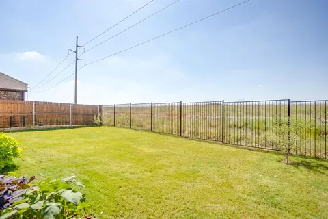 a view of an empty room with a yard
