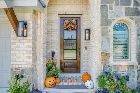 a front view of a house with chairs