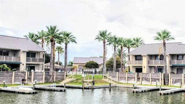 a view of house with swimming pool and lake view