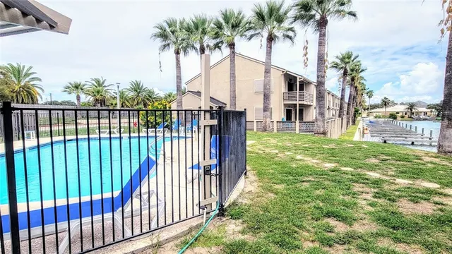 a view of a balcony with table and chairs