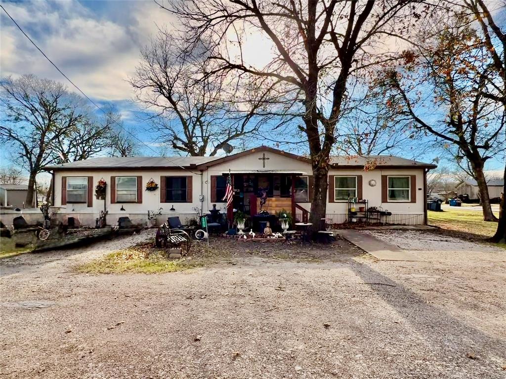 a view of a house with couches in front of house