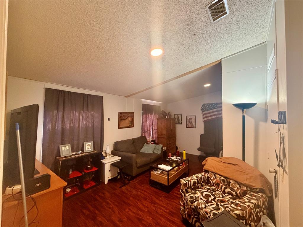 205 Hamilton Street Bynum, TX 76631 - Photo 22 of 29 a living room with furniture