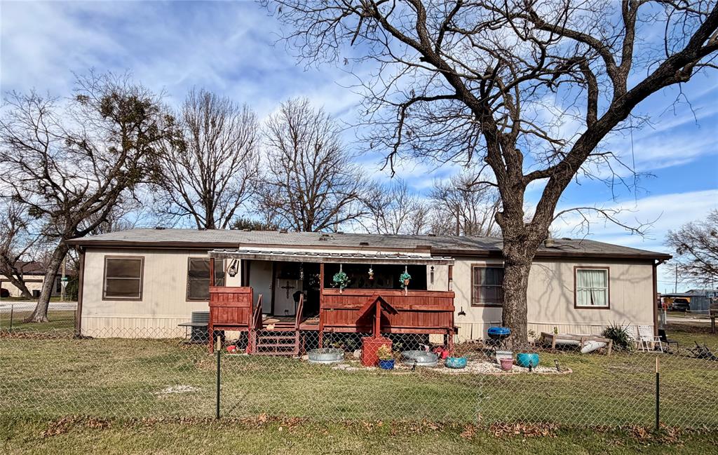 205 Hamilton Street Bynum, TX 76631 - Photo 27 of 29 a view of a house with backyard