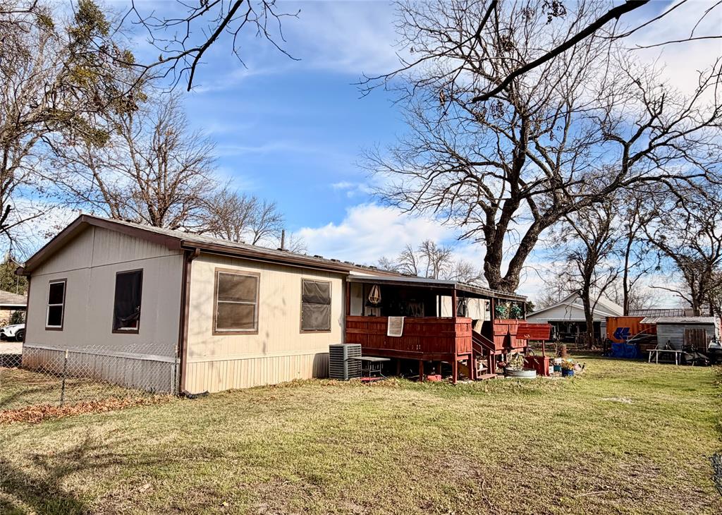 205 Hamilton Street Bynum, TX 76631 - Photo 28 of 29 a view of a house with a patio