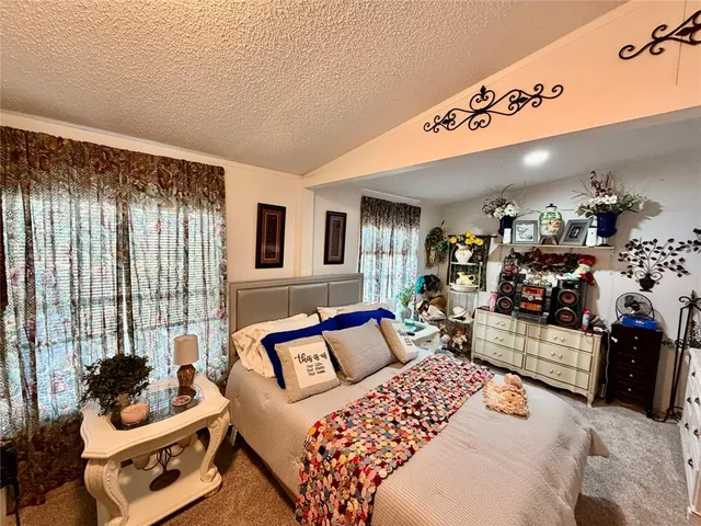 a bedroom with furniture and a bed