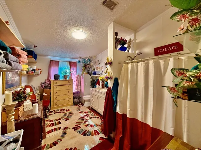 a view of a workspace with furniture and a living room