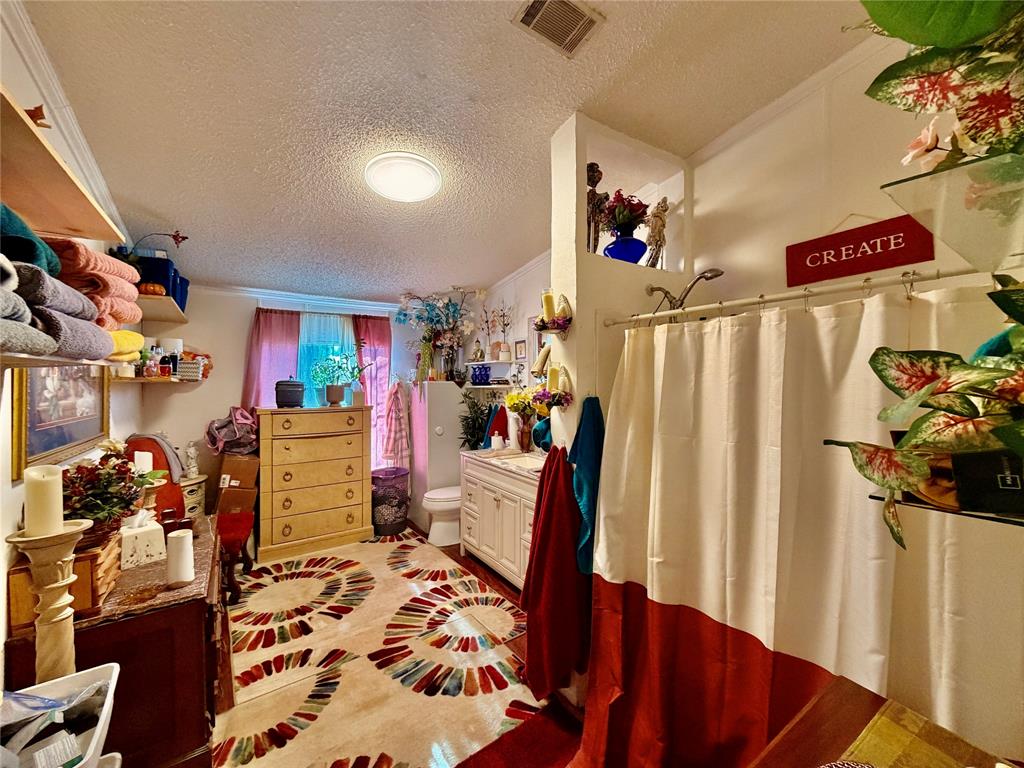 205 Hamilton Street Bynum, TX 76631 - Photo 8 of 29 a view of a workspace with furniture and a living room