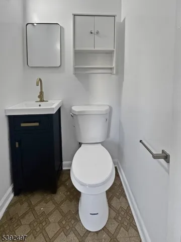 a bathroom with a toilet and a sink