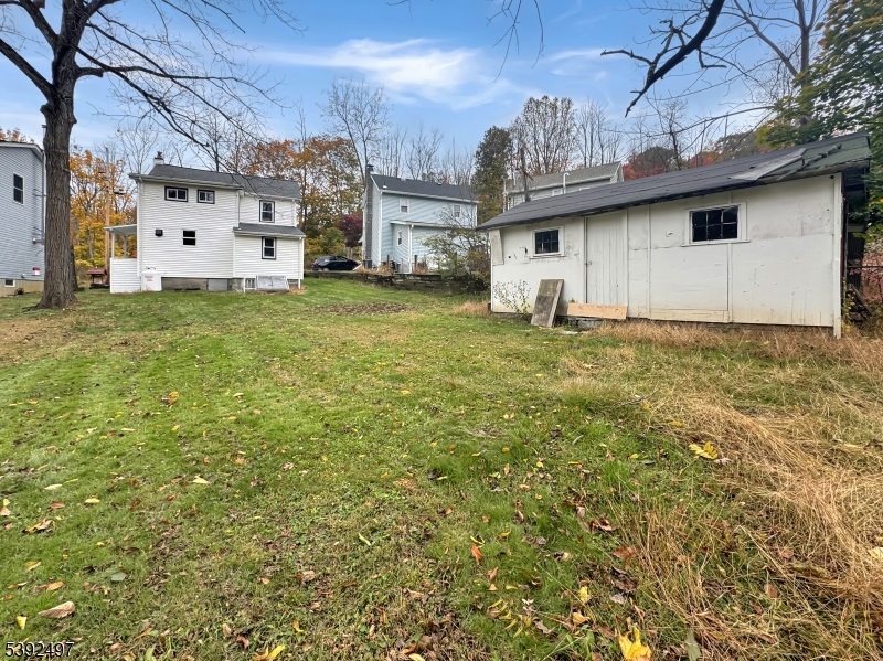 5 Orams Lane Oxford, NJ 07863 - Photo 31 of 31 a view of a white house with a big yard and large tree