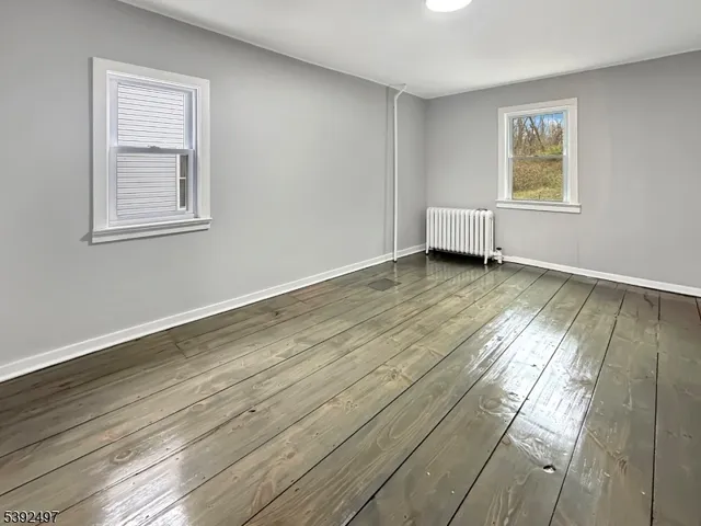 a view of an empty room and window