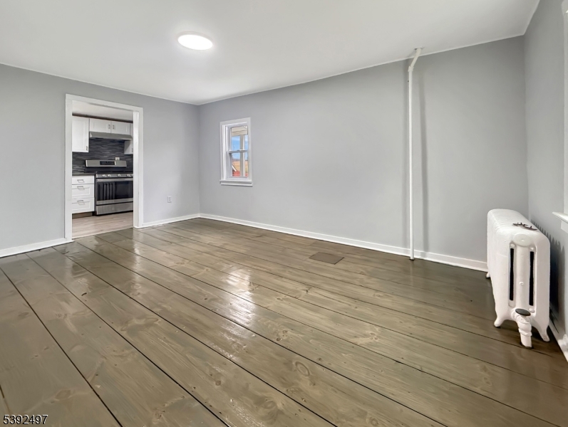 5 Orams Lane Oxford, NJ 07863 - Photo 5 of 31 an empty room with wooden floor and a window