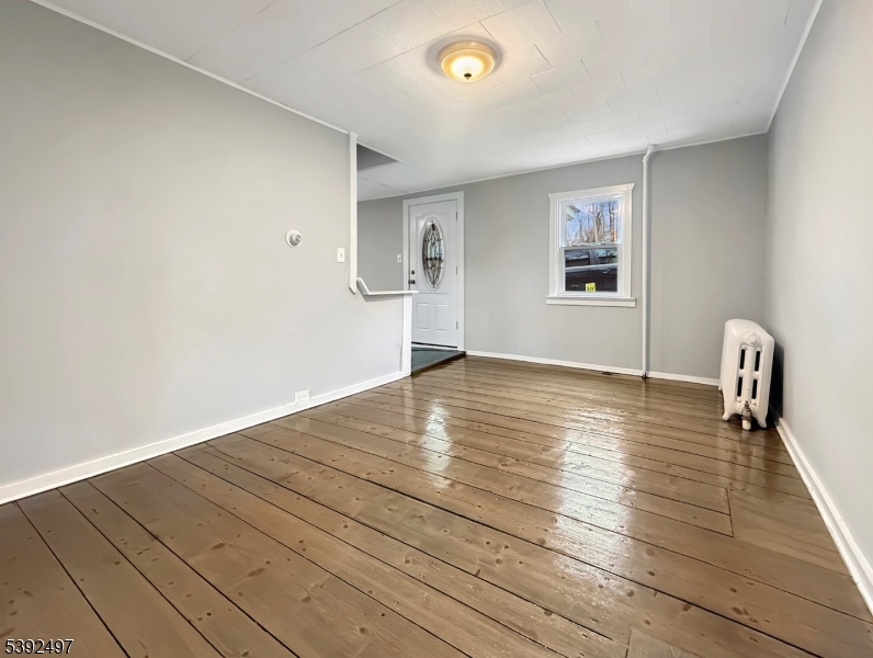 5 Orams Lane Oxford, NJ 07863 - Photo 6 of 31 a view of empty room with wooden floor and fan