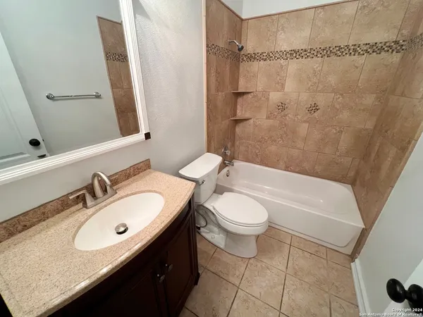 a bathroom with a tub and a shower