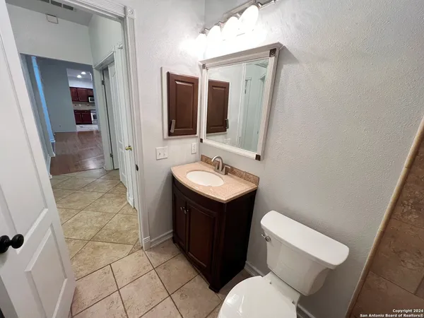 a view of a livingroom with an empty space and a window
