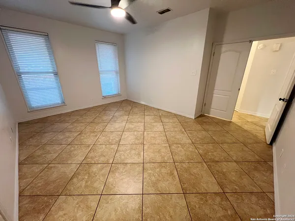 a bathroom with a tub a sink and a shower