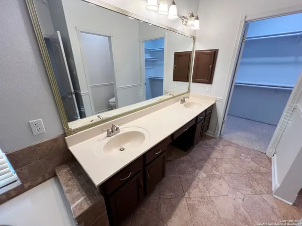 a bathroom with a sink a toilet and vanity