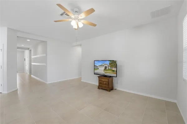 a kitchen with stainless steel appliances granite countertop a refrigerator a stove a sink and a microwave