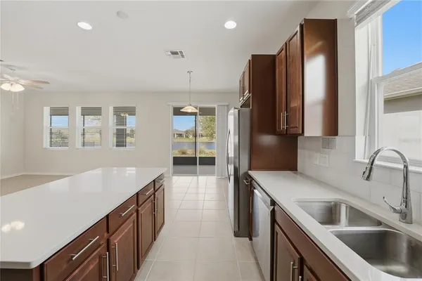 a bathroom with a granite countertop sink toilet a large mirror and shower