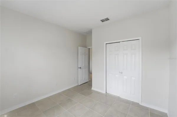 an aerial view of a house with a lake view