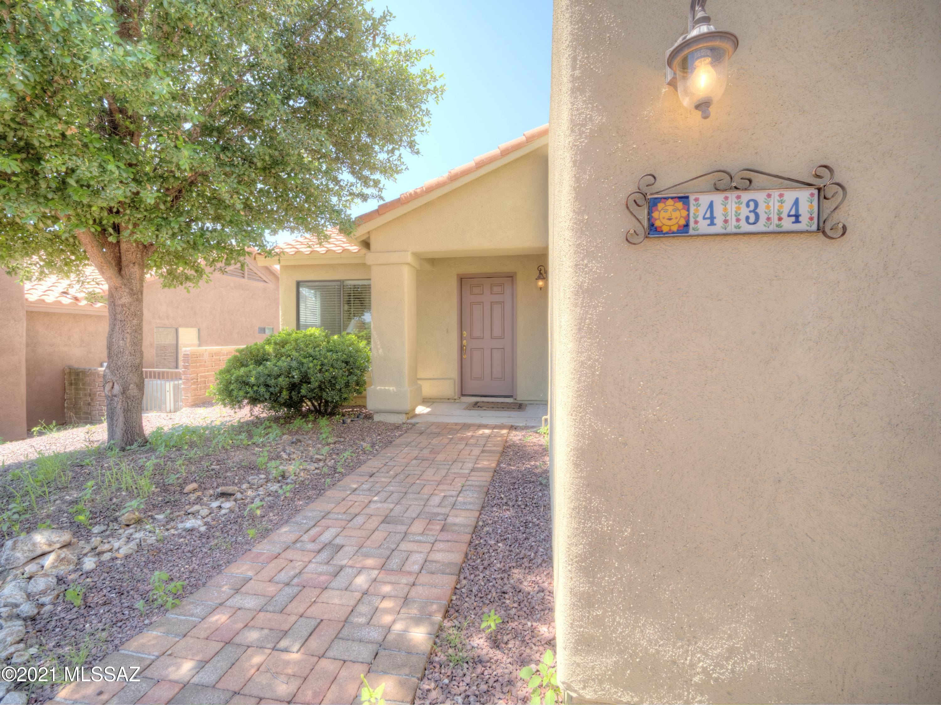 434 Colorado Court Rio Rico, AZ 85648 - Photo 2 of 29 a view of a door and chair in the backyard