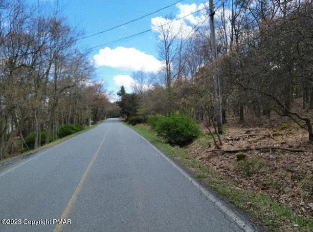 a view of a road with a yard