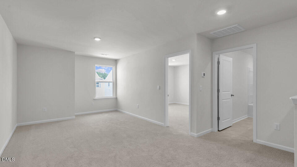 145 Westerly Way Lillington, NC 27546 - Photo 13 of 34 an empty room with windows