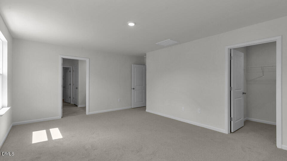 145 Westerly Way Lillington, NC 27546 - Photo 15 of 34 a view of an empty room and a window