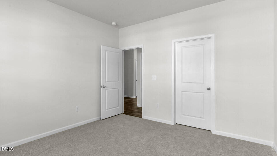 145 Westerly Way Lillington, NC 27546 - Photo 18 of 34 an empty room with closet area