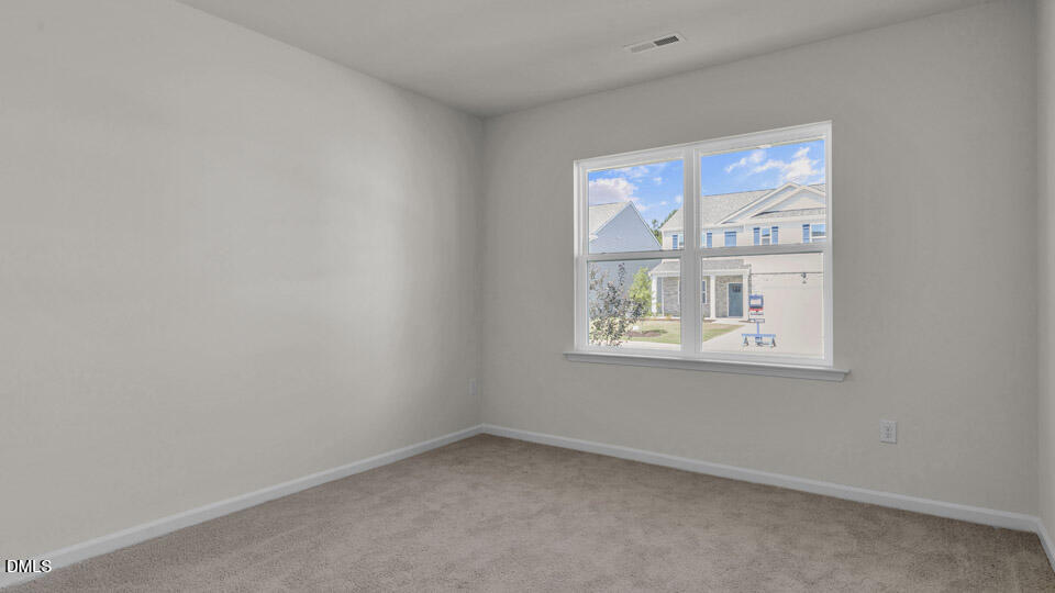 145 Westerly Way Lillington, NC 27546 - Photo 19 of 34 an empty room with a window