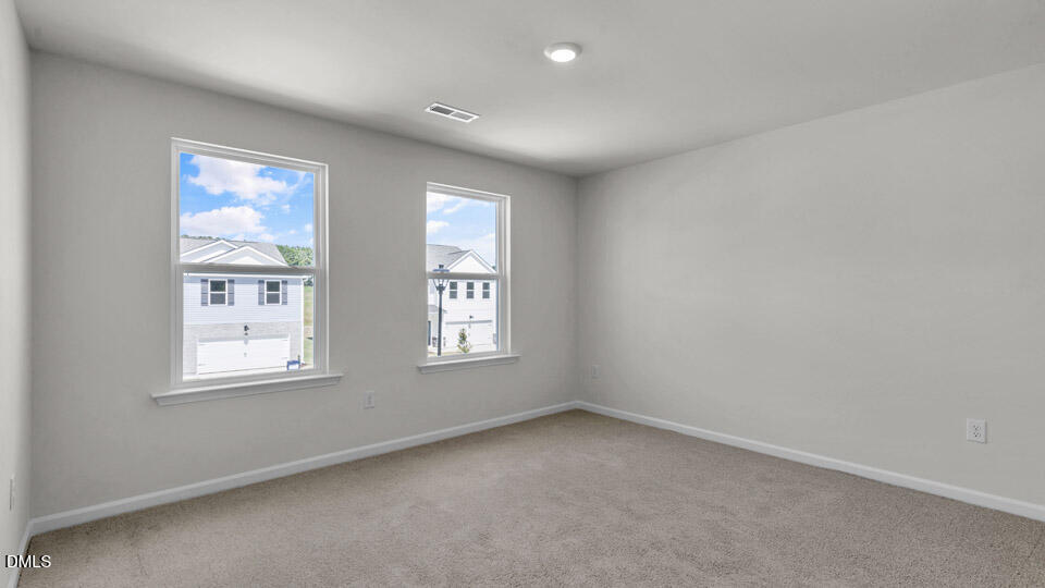 145 Westerly Way Lillington, NC 27546 - Photo 21 of 34 an empty room with windows