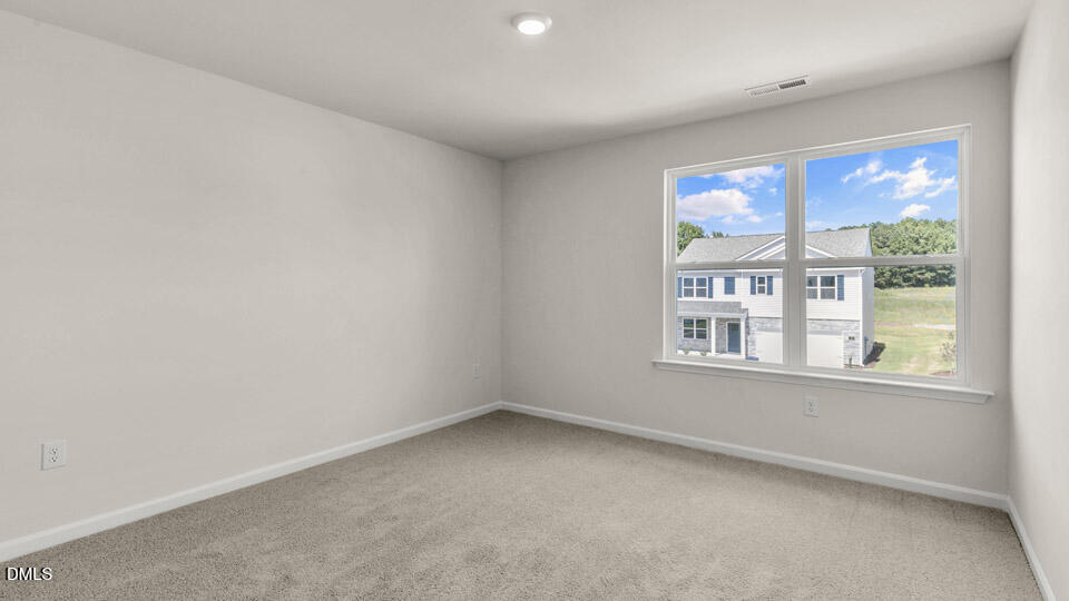 145 Westerly Way Lillington, NC 27546 - Photo 23 of 34 an empty room with a window