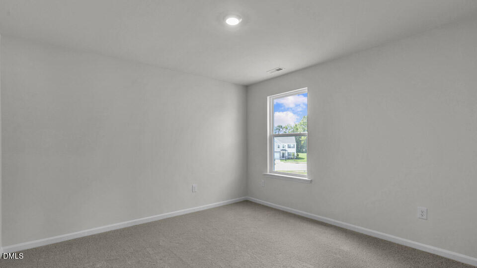 145 Westerly Way Lillington, NC 27546 - Photo 25 of 34 an empty room with windows and mirror