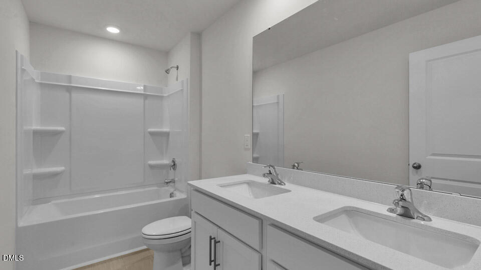 145 Westerly Way Lillington, NC 27546 - Photo 27 of 34 a bathroom with a sink toilet and shower