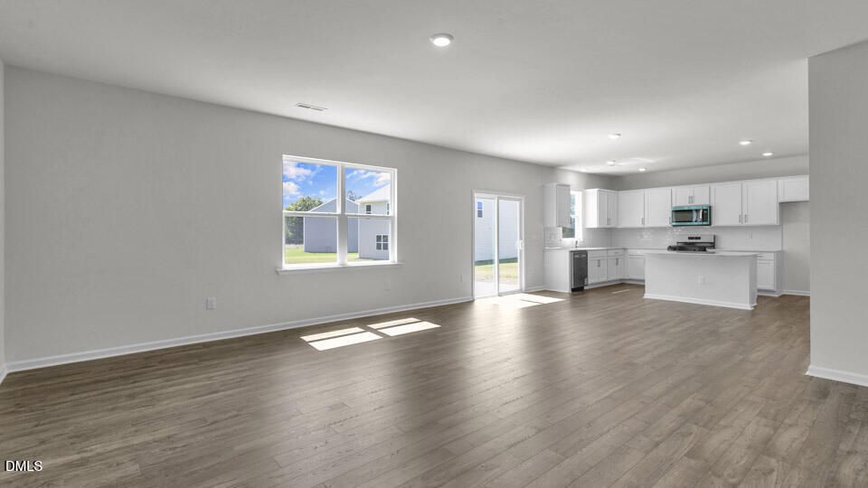 145 Westerly Way Lillington, NC 27546 - Photo 8 of 34 a view of kitchen with wooden floor electronic appliances and window
