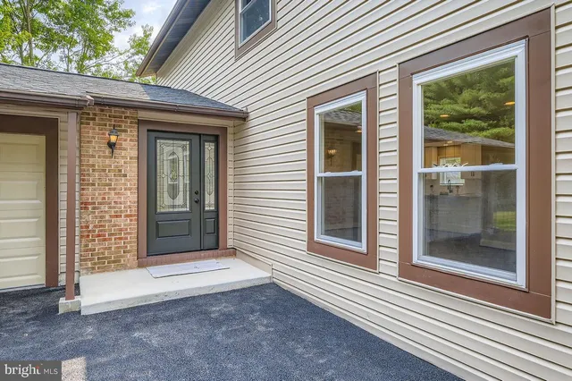 a view of a wooden house with a large window