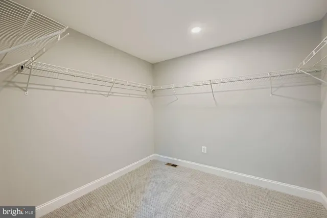 a view of a room with racks on the wall