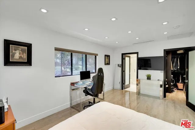 a bathroom with double vanity sink and a mirror