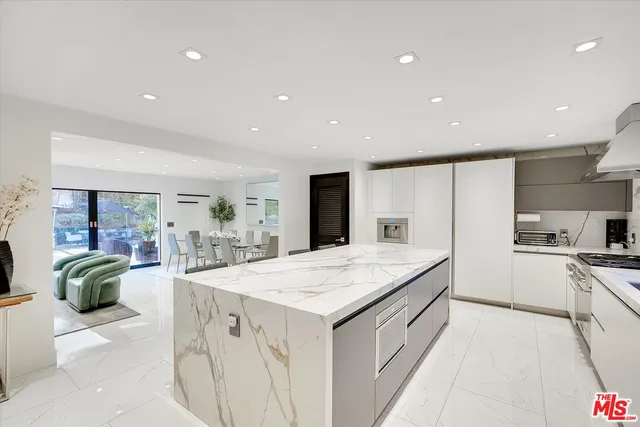 a view of a kitchen sink and a window