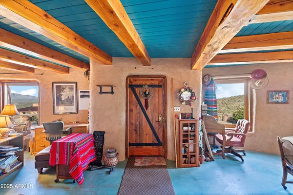 a living room with lots of furniture and a rug