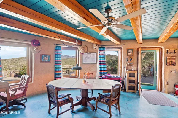 a view of living room with furniture and a flat screen tv