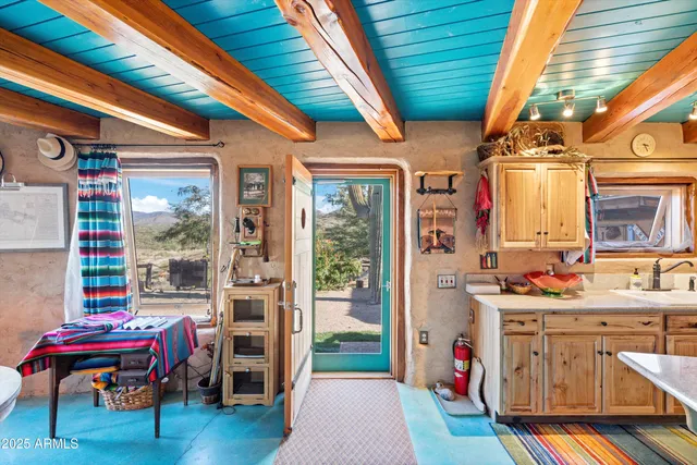 an aerial view of residential house with an outdoor space and mountain view
