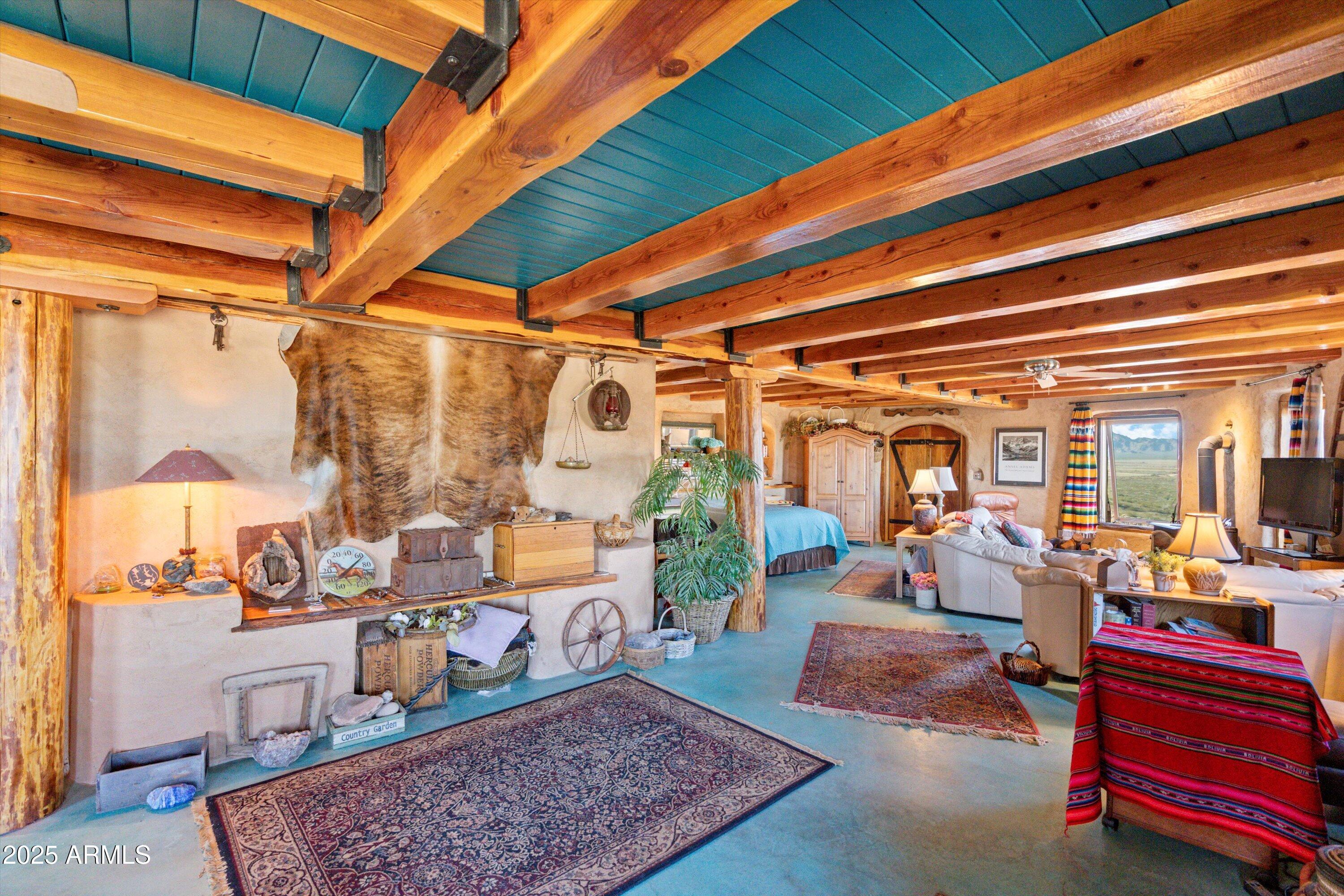69182 North Centennial Park Road Salome, AZ 85348 - Photo 28 of 91 a living room with lots of furniture and a rug