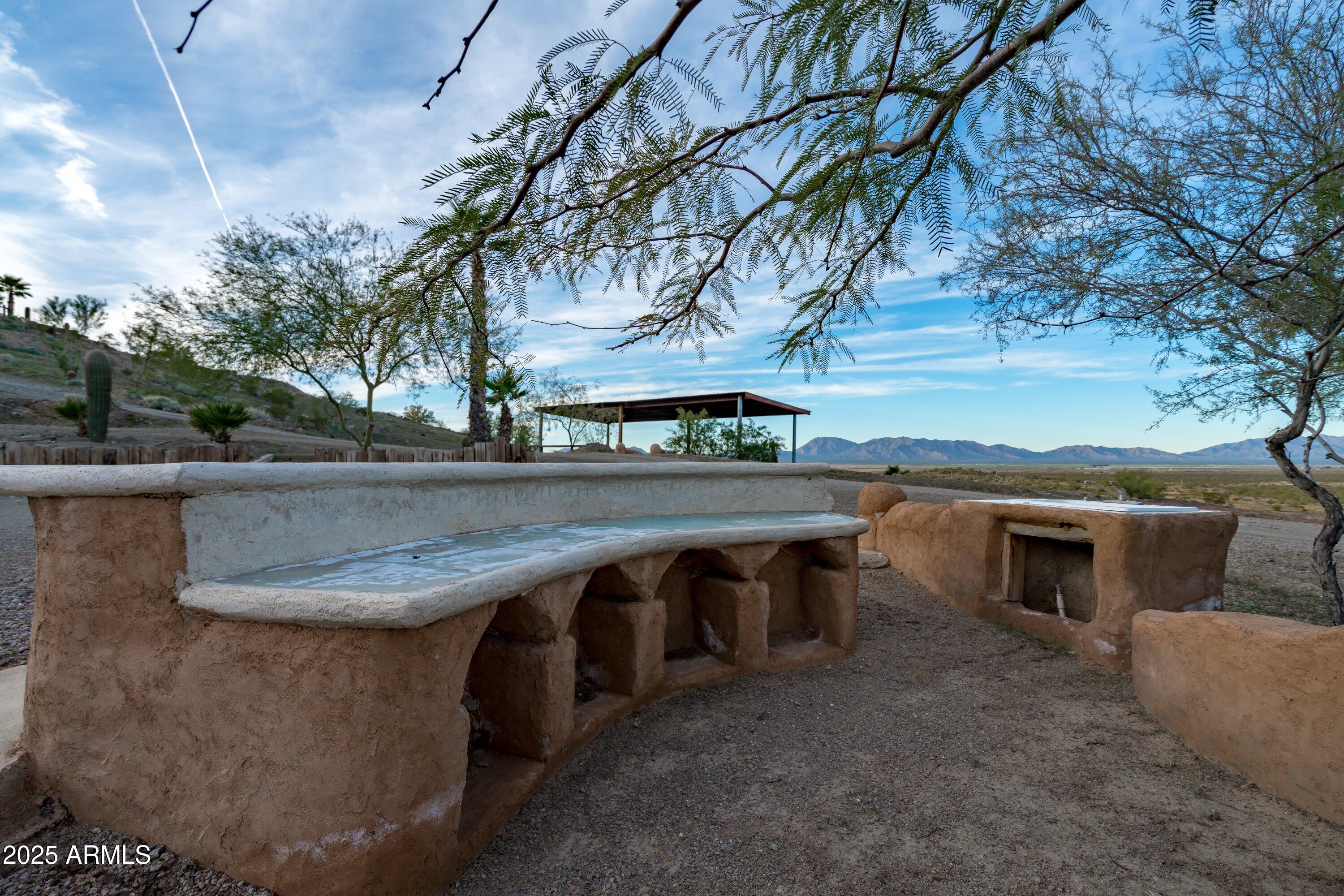 69182 North Centennial Park Road Salome, AZ 85348 - Photo 65 of 91 a backyard of a house with table and chairs