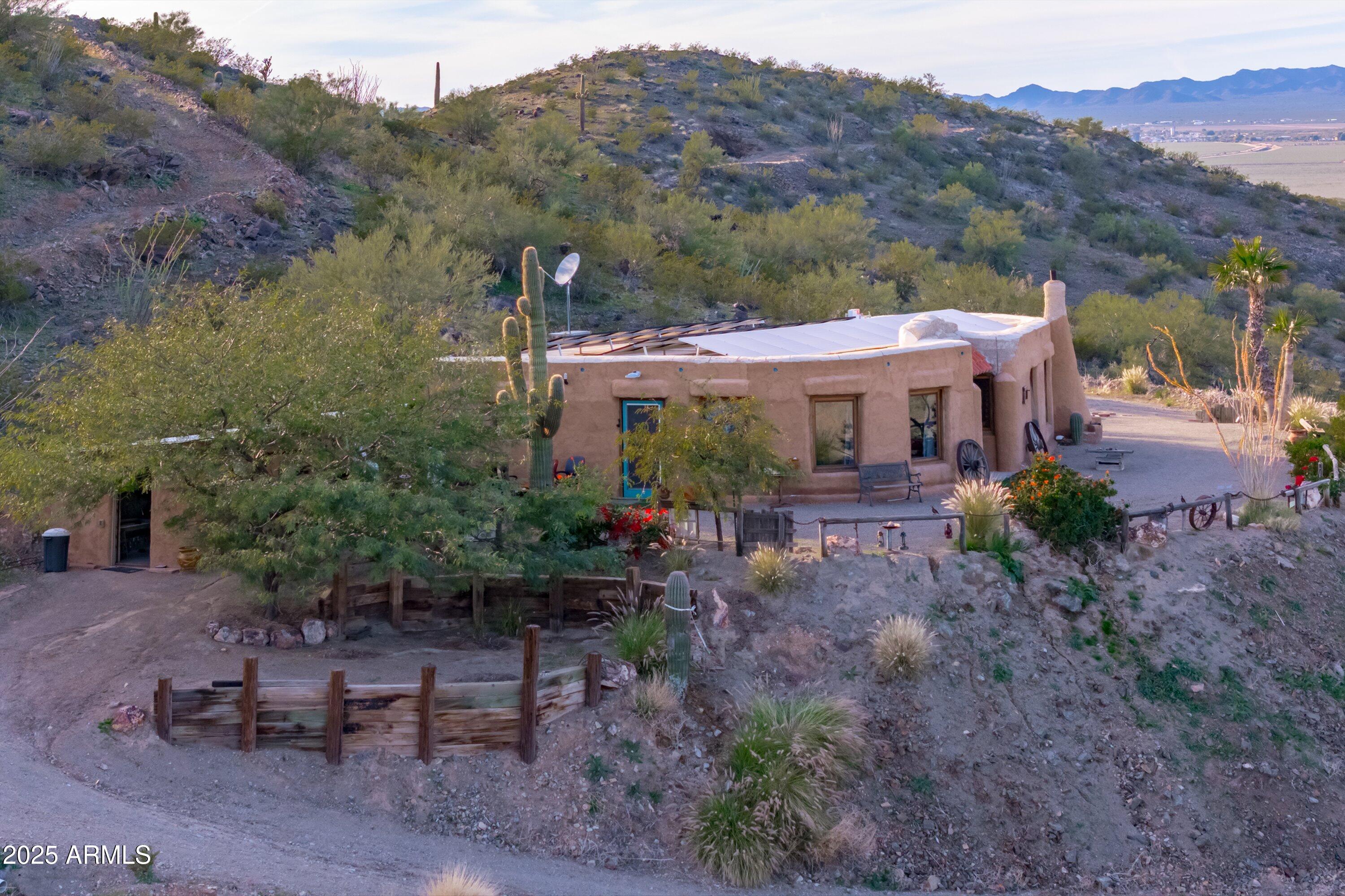 69182 North Centennial Park Road Salome, AZ 85348 - Photo 82 of 91 a view of a patio with a table and chairs under an umbrella