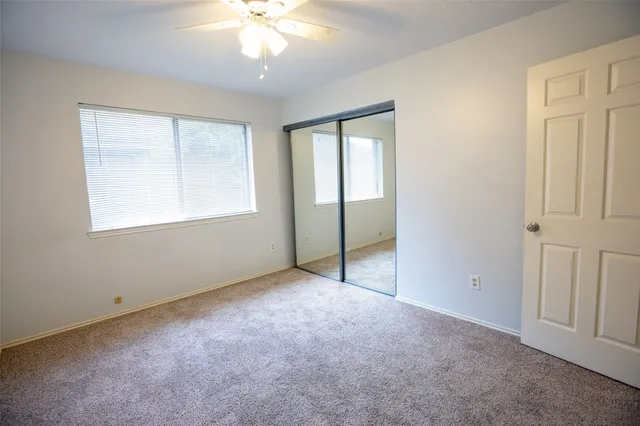 a bathroom with a granite countertop sink a mirror and a vanity