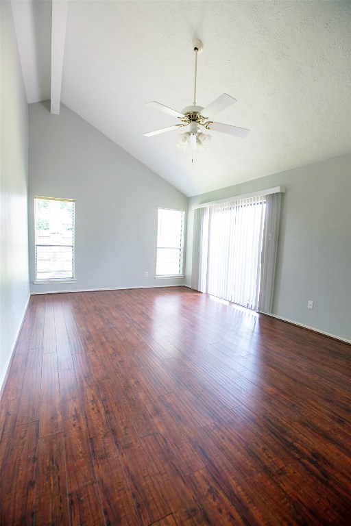 415 Abbott Circle Sugar Land, TX 77498 - Photo 15 of 19 Primary Suite. Tall vaulted ceilings, wood flooring and freshly painted. Sliding doors lead you to the backyard.