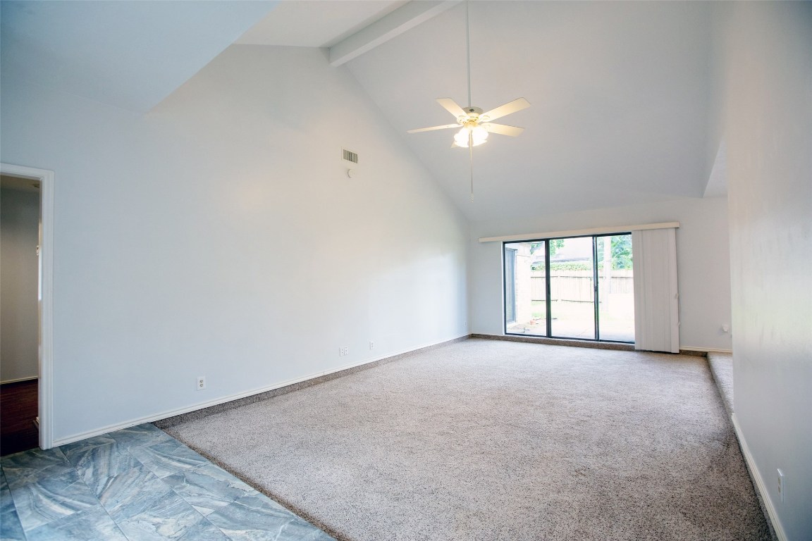 415 Abbott Circle Sugar Land, TX 77498 - Photo 5 of 19 Massive living room with vaulted ceiling gives this space a inviting appeal.