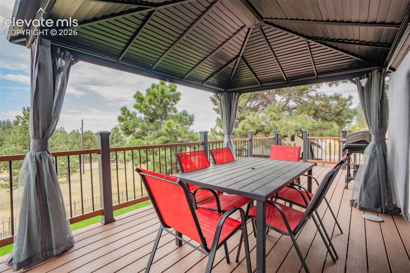 17370 Sweet Road Peyton, CO 80831 - Photo 14 of 47 Great outdoor dining space, pergola is included with purchase if the Buyer would like to keep it. The perfect place to BBQ!